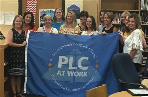 Picture of teachers receiving a PLC award  